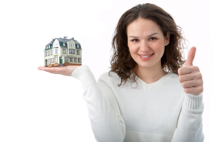 woman with little house on palm over white background