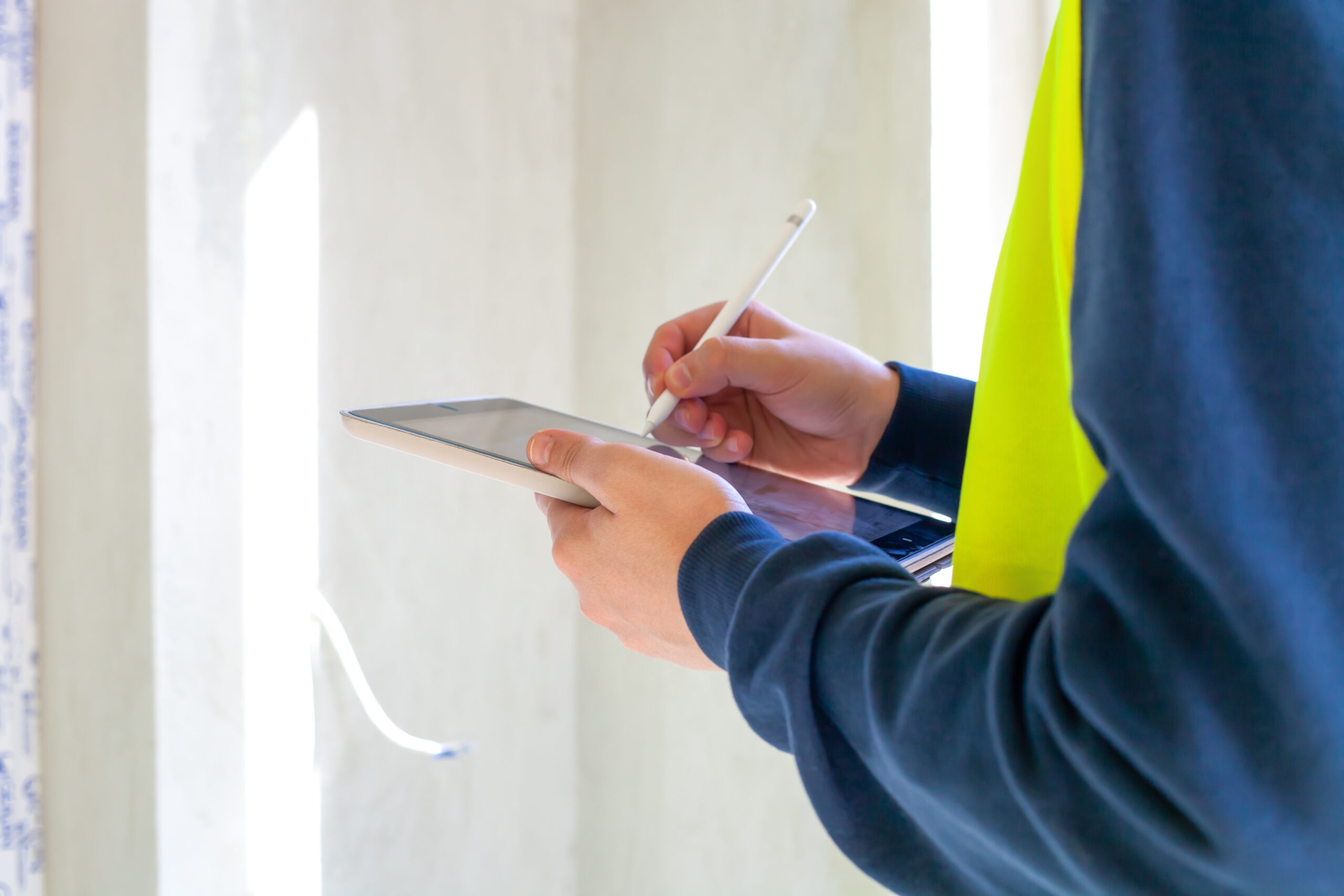 Civil,Engineer,Hold,Tablet,Computer.,Close,Up,Hand,Using,Mobile